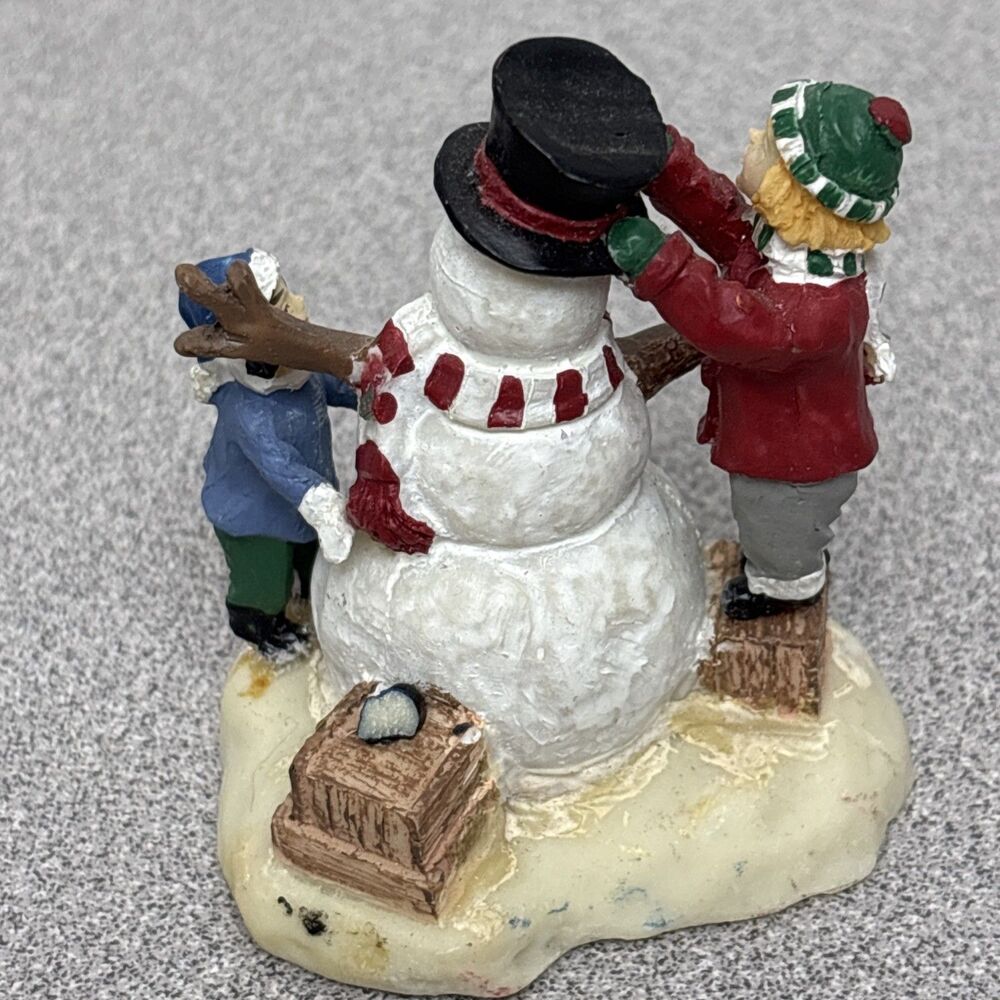 Christmas Village Children Building A Snowman Figurine, 2” Tall - Picture 5 of 7